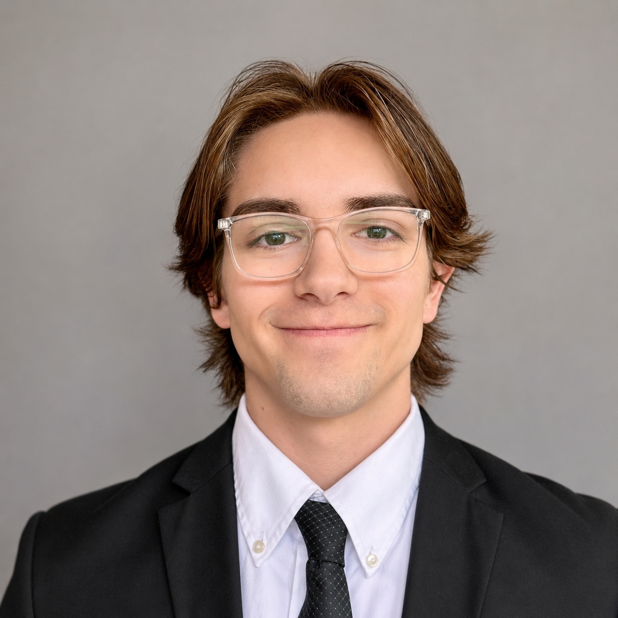 Corbin Rollins in a suit and tie with his longer hair before his missionary haircut